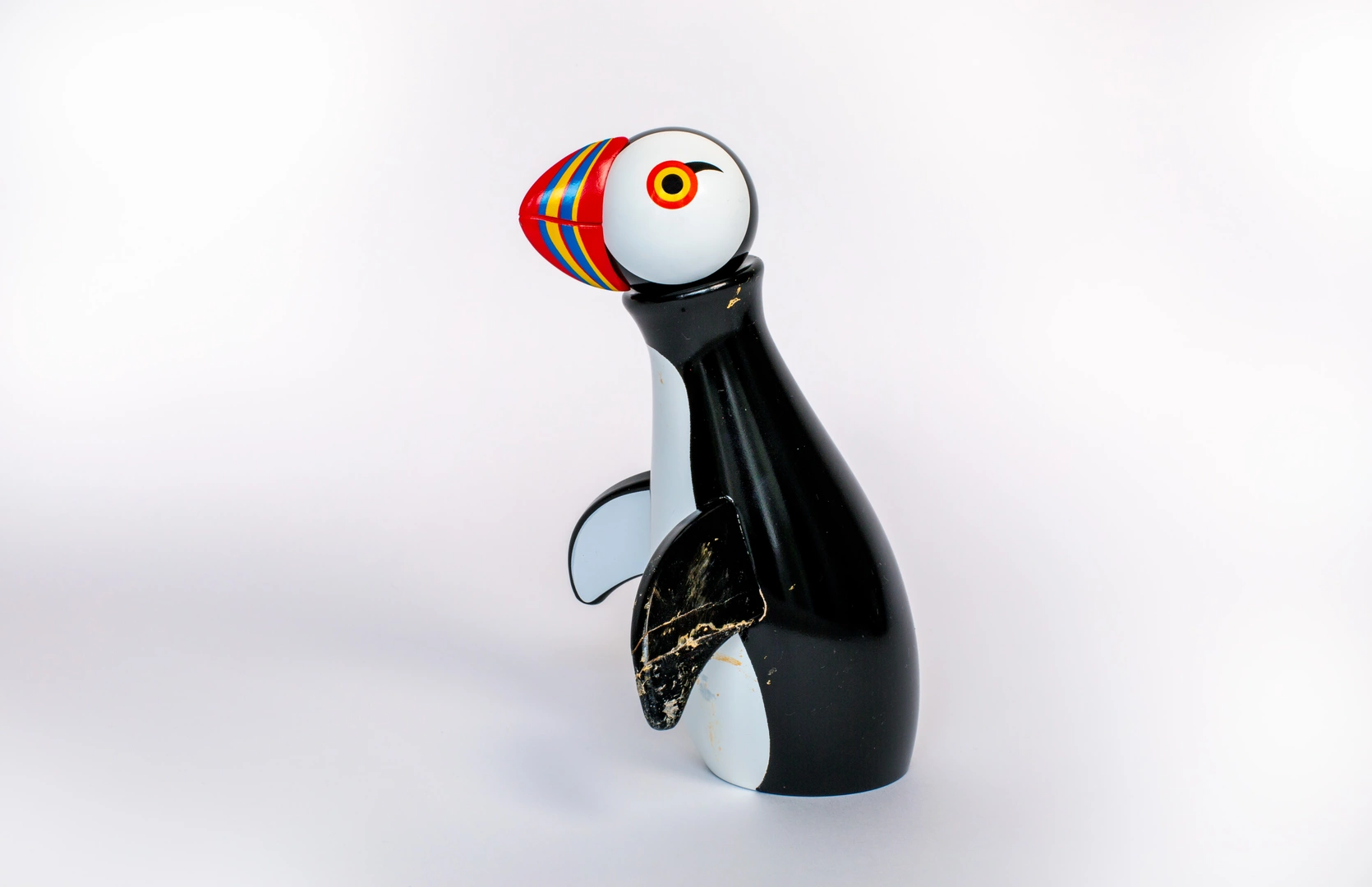 Broken puffin figurine